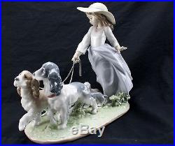 LLADRO Privilege Porcelain Girl with Walking Dogs and Puppies