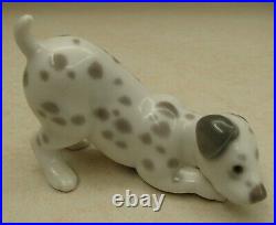 Lladro 1261 Dalmatian Dalmatian puppy dog playing MWOB, RV$475