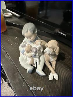 Lladro # 5456 Boy With Puppies