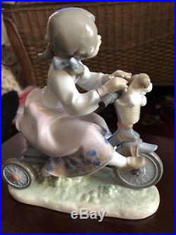 Lladro 5680 Traveling In Style Girl on Bike with puppies/dog