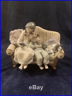 Lladro 5735 girl reading to child with dog on the couch. MINT CONDITION