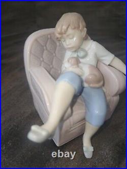 Lladro 6549 Naptime with Friends Boy with Puppy Sleeping on Chair Figurine