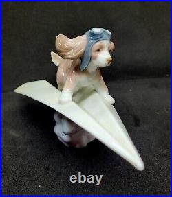 Lladro #6665 Let's Fly Away Adorable Puppy on a Paper Airplane