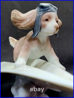 Lladro #6665 Let's Fly Away Adorable Puppy on a Paper Airplane