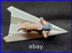 Lladro #6665 Let's Fly Away Adorable Puppy on a Paper Airplane