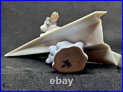 Lladro #6665 Let's Fly Away Adorable Puppy on a Paper Airplane