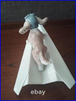 Lladro 6665 Let's Fly Away Dog on Paper Airplane Porcelain Figurine