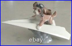 Lladro 6665 Let's Fly Away goggled puppy dog on a paper airplane MIB, RV$210