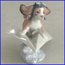 Lladro 6665 Let's Fly Away goggled puppy dog on a paper airplane MIB, RV$210