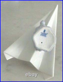 Lladro 6665 Let's Fly Away goggled puppy dog on a paper airplane MIB, RV$210