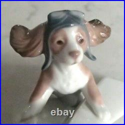 Lladro 6665 Let's Fly Away goggled puppy dog on a paper airplane MIB, RV$210