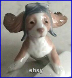 Lladro 6665 Let's Fly Away goggled puppy dog on a paper airplane MIB, RV$210