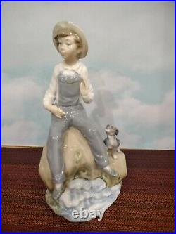 Lladro Boy with Dog Figurine