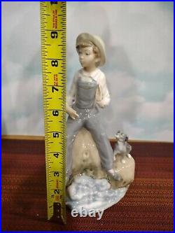 Lladro Boy with Dog Figurine