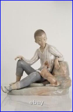 Lladro Boy with Dog Porcelain Figurine L 10