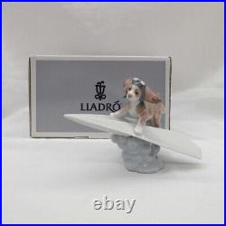 Lladro Dog on a Paper Plane Puppy Porcelain Figurine 010.06665