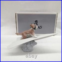 Lladro Dog on a Paper Plane Puppy Porcelain Figurine 010.06665