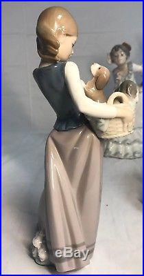 Lladro Figurine #1311 Little Dogs On Hip Girl With a Basket Full Of Puppies