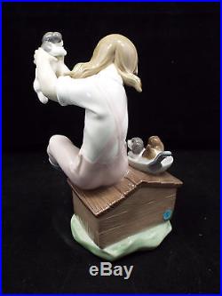 Lladro Figurine #7621 Pick of the Litter, Girl on Dog House Picking Puppy, w box