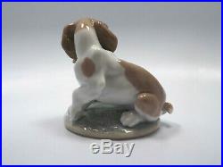 Lladro Figurine #7672 It Wasn't Me, Puppy Dog with Flowers, with box
