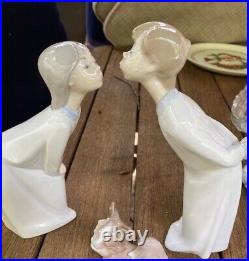 Lladro Figurines Girl and Boy Kiss 8 inches high (dog not included)