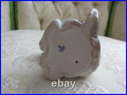 Lladro Gentle Surprise Dog with Butterfly #6210