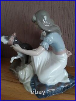 Lladro. Girl giving her dog medication Take your medication No. 5921