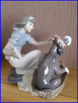 Lladro. Girl giving her dog medication Take your medication No. 5921