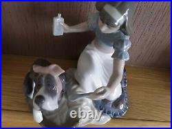 Lladro. Girl giving her dog medication Take your medication No. 5921