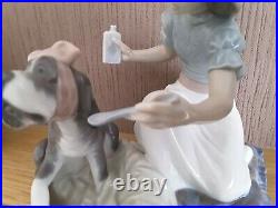 Lladro. Girl giving her dog medication Take your medication No. 5921