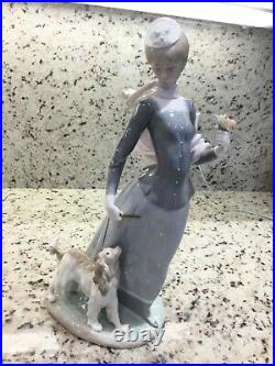 Lladro Lady Walking Her Dog on The Leash Wearing Shawl and Hat Holding Flowers