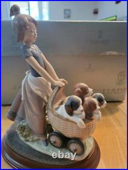 Lladro Litters of Love #5364 Girl with dogs stroller