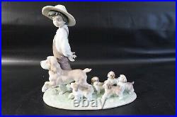 Lladro Little Explorers #6828 Boy walking dogs