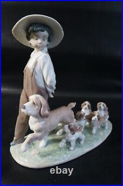 Lladro Little Explorers #6828 Boy walking dogs