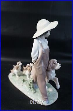 Lladro Little Explorers #6828 Boy walking dogs