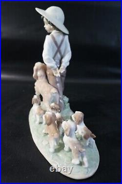 Lladro Little Explorers #6828 Boy walking dogs