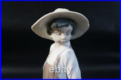 Lladro Little Explorers #6828 Boy walking dogs