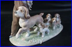 Lladro Little Explorers #6828 Boy walking dogs