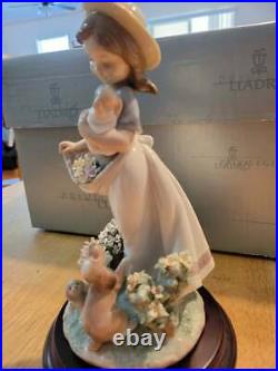 Lladro Romp in the Garden #6907 Girl with dogs flowers