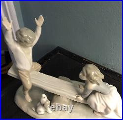 Lladro, authentic Boy and Girl with Dog on Seesaw, glossy figurine