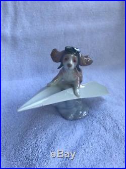 Lladro dog #6665 with box and certificate lets fly away
