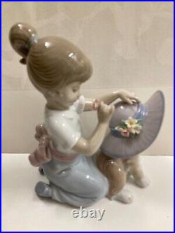 Lladro figurine #6862 An Elegant Touch Young girl dressing a dog