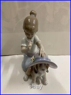 Lladro figurine #6862 An Elegant Touch Young girl dressing a dog