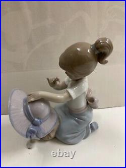 Lladro figurine #6862 An Elegant Touch Young girl dressing a dog