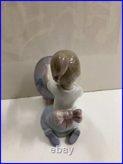 Lladro figurine #6862 An Elegant Touch Young girl dressing a dog