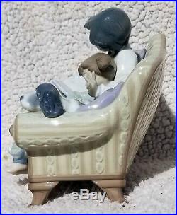 Lladro girl reading to child with dog on the couch
