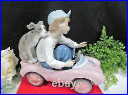 Lladro porcelain figurine Out for a Spin #5770 boy with Dog puppy made in Spain