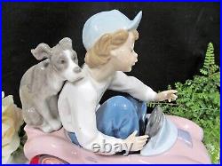 Lladro porcelain figurine Out for a Spin #5770 boy with Dog puppy made in Spain