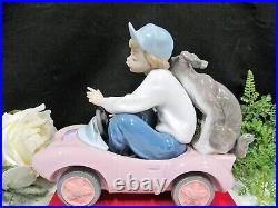 Lladro porcelain figurine Out for a Spin #5770 boy with Dog puppy made in Spain