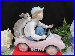 Lladro porcelain figurine Out for a Spin #5770 boy with Dog puppy made in Spain